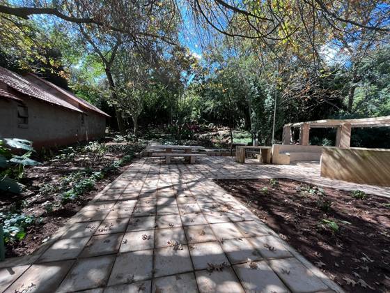 Paved path to the boma and picnic tables