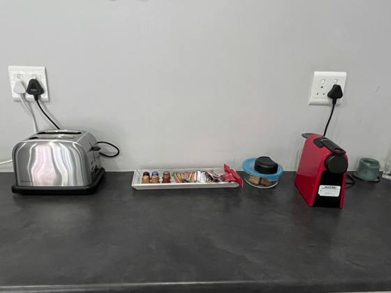 Coffee machine and toaster on the counter