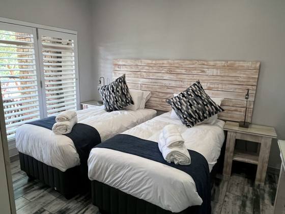 The bedroom, made up with two single beds