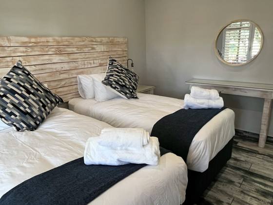Two single beds with fresh linen and towels
