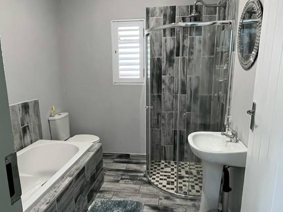 Bathroom with shower and bath