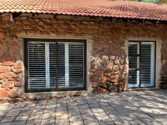 Stone-walled unit with shutter doors